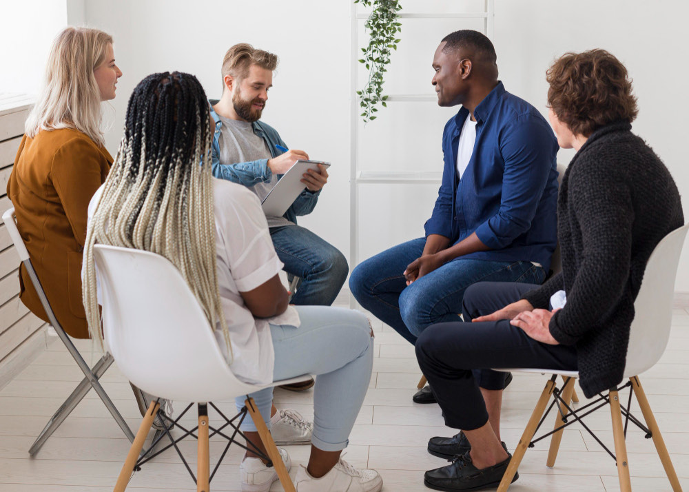 Adults gathered for a community meeting